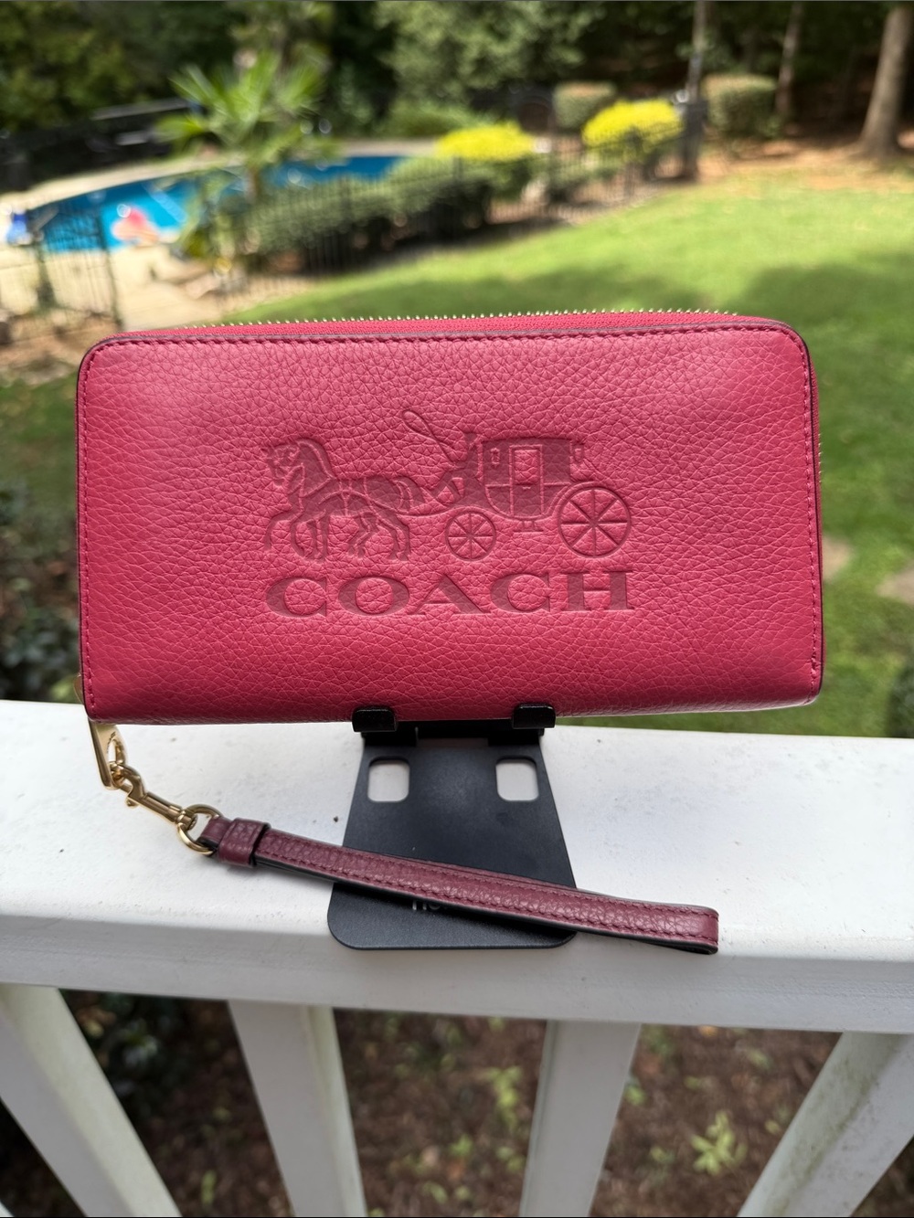 Coach Rose Pink Pebbled Leather horse and carriage zip around wallet.